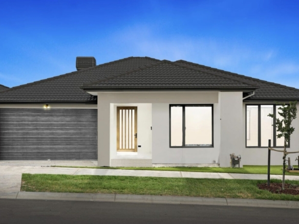 Modern single storey suburban house with double garage, sleek facade and landscaped front yard.